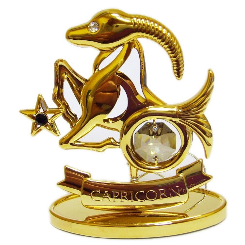 Знак зодиака Козерог, несколько кристаллов Swarovski, главный - топаз и золотое покрытие.